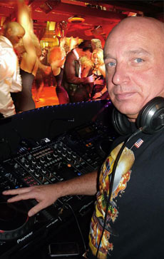 John Ditch performing behind the DJ booth